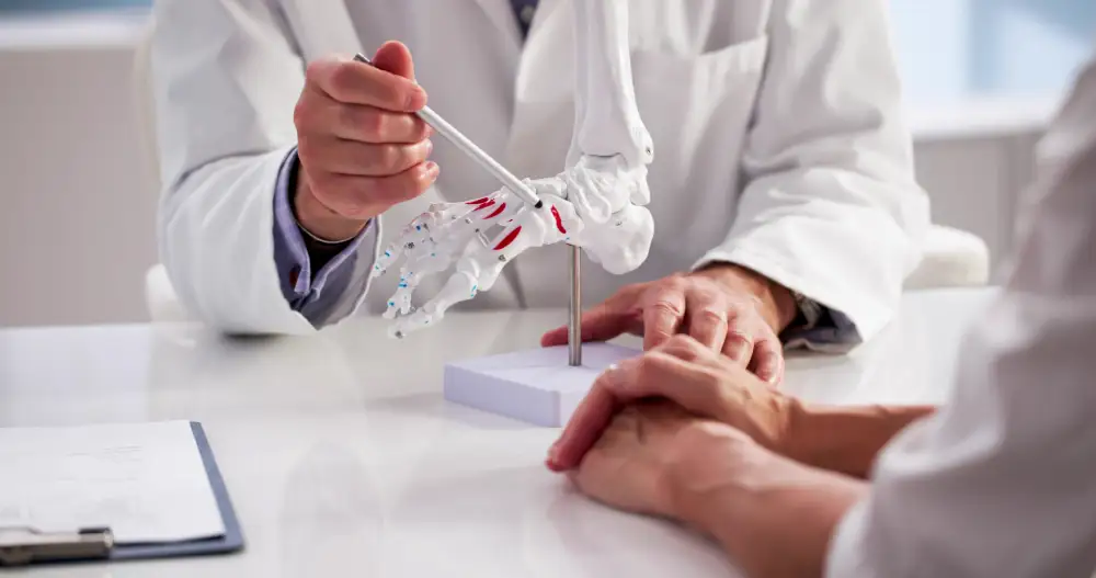 Foot and ankle specialist explaining the condition and treatment options to a patient.